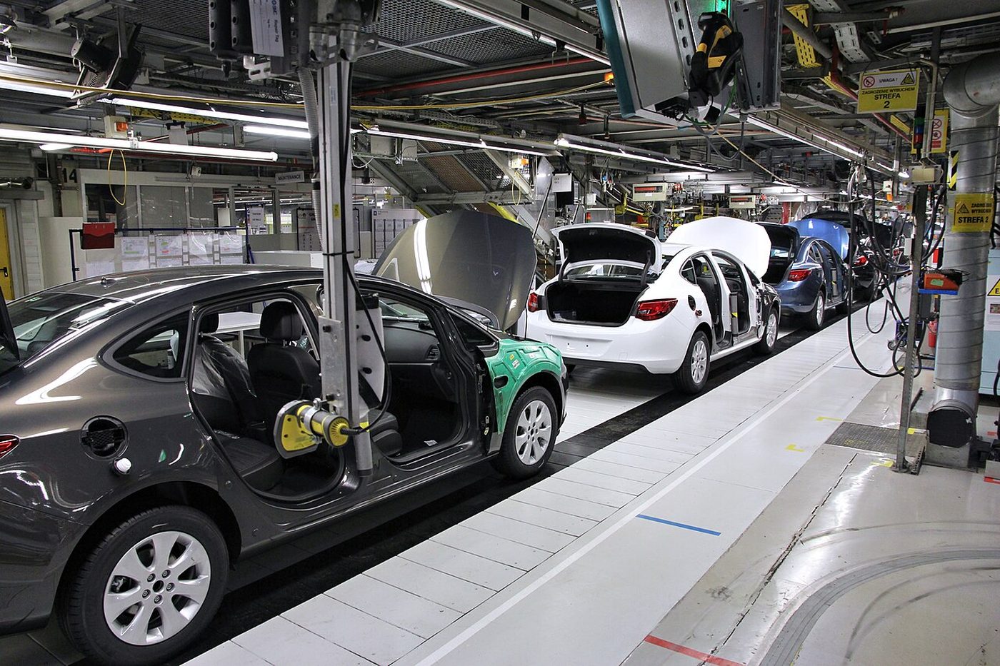 Automotive body assembly using custom parts